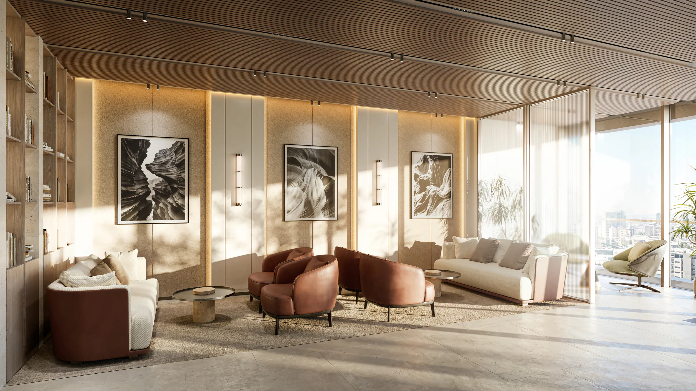 A business lounge with armchairs and framed photographs in afternoon light