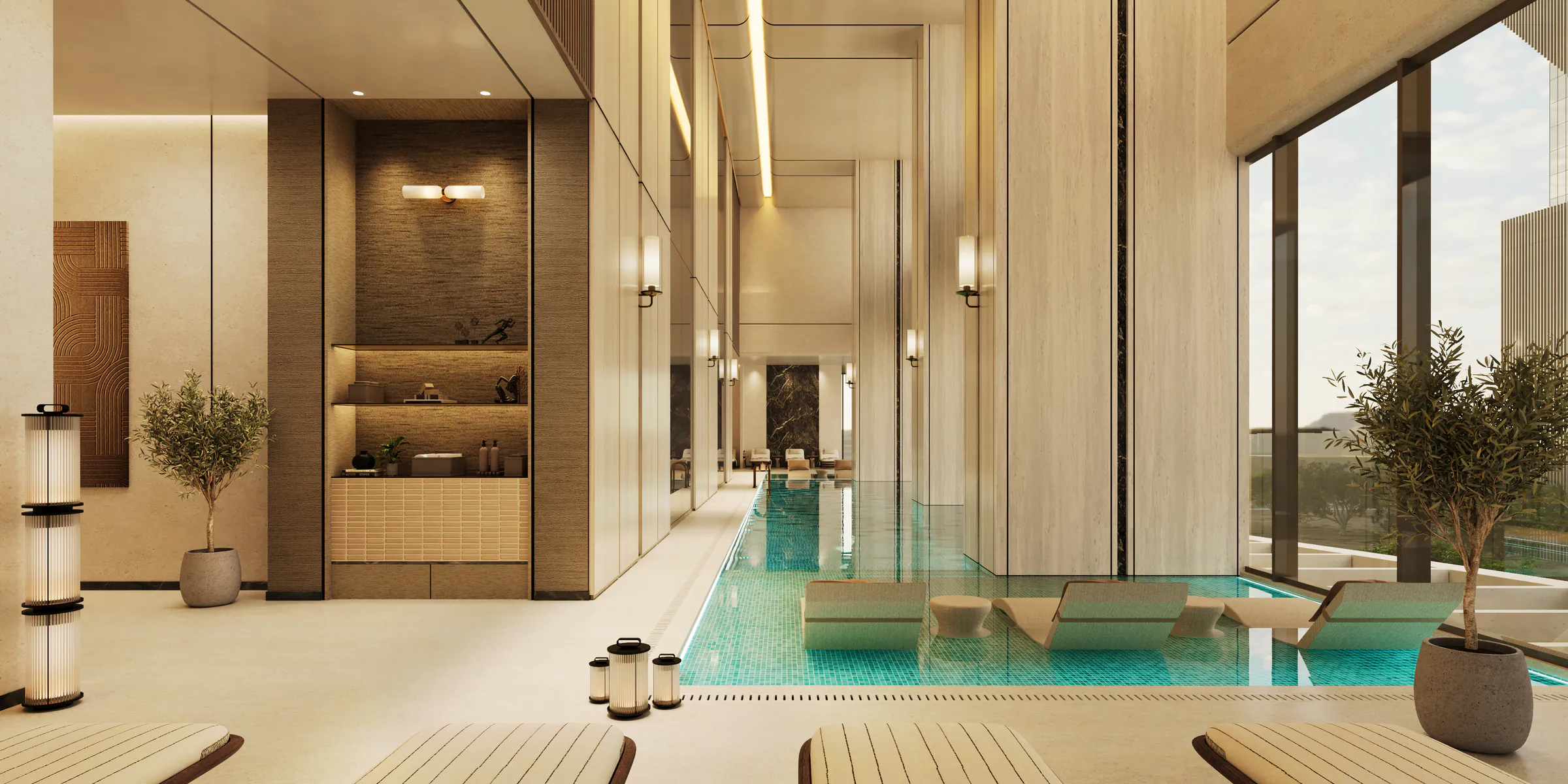 The indoor pool under a high ceiling, loungers along its edge