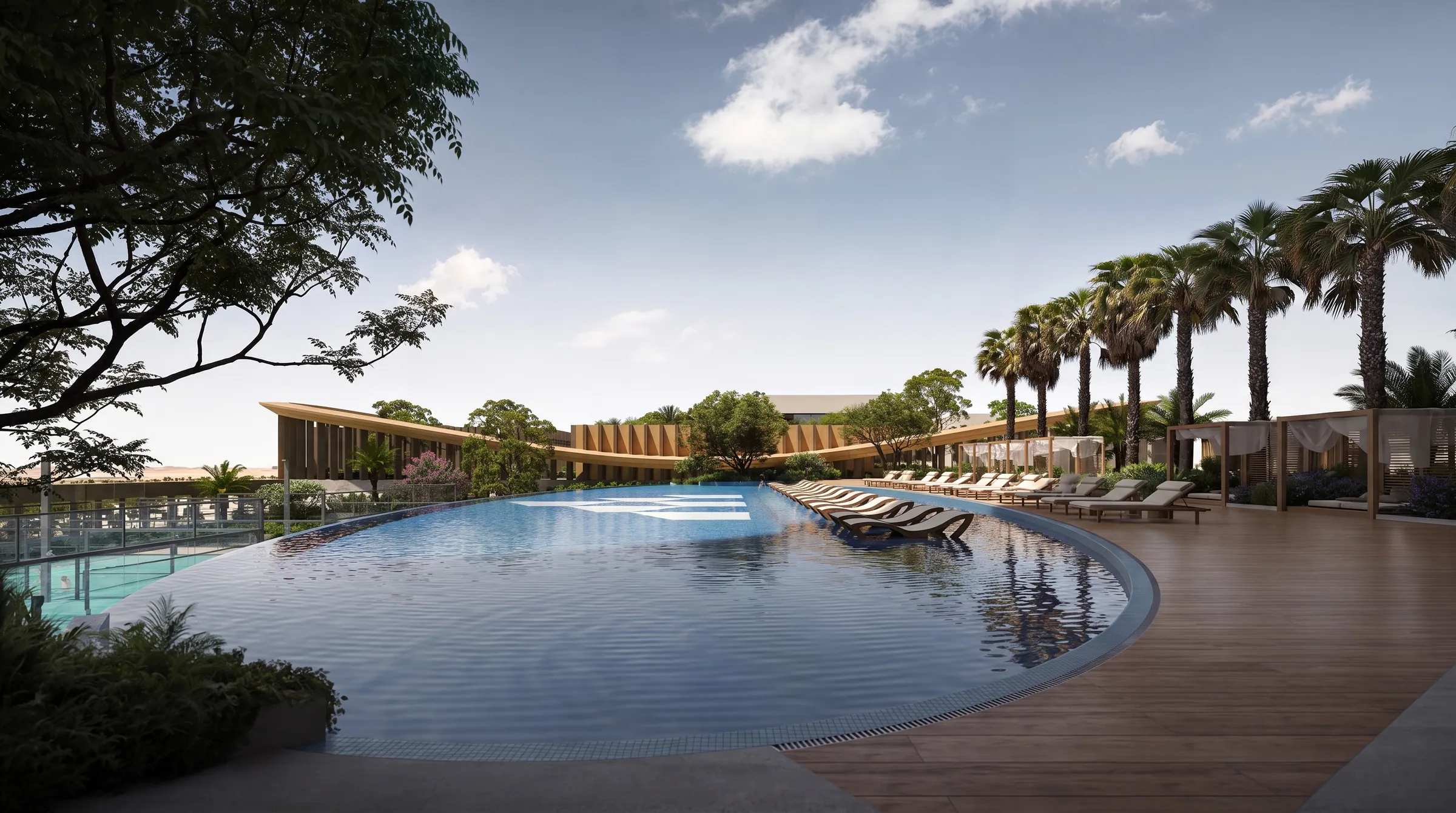 The long outdoor pool lined with palms and loungers under an open sky